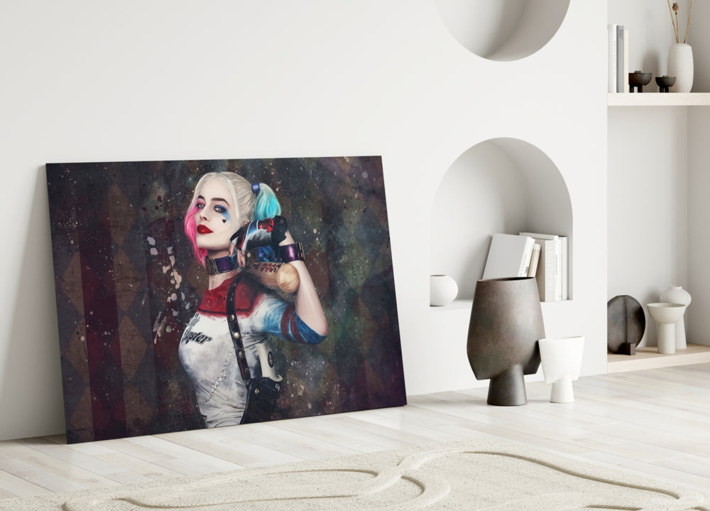 Harley Quinn close-up showing pigtailed heroine on harlequin diamond paint-flecked wall