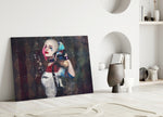 Harley Quinn close-up showing pigtailed heroine on harlequin diamond paint-flecked wall
