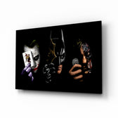 Batman Joker Harvey glass wall art displayed above a leather chesterfield in a brick-walled home theater with reclaimed-wood console and projector screen