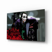 Joker glass wall art displayed above a leather chesterfield in a brick-walled home theater with reclaimed-wood console and projector screen