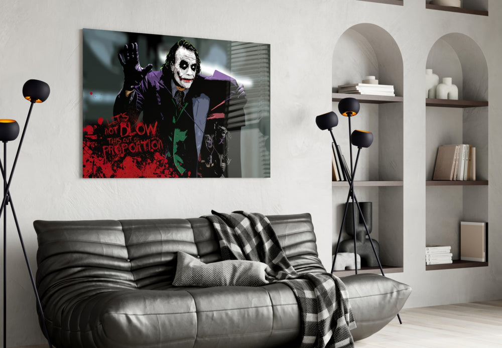 Joker glass wall art styled above a sofa in a gaming room