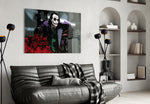 Joker glass wall art styled above a sofa in a gaming room