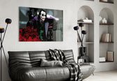 Joker glass wall art styled above a sofa in a gaming room