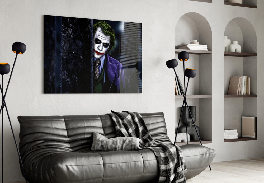 Joker glass wall art styled above a sofa in a gaming room