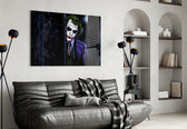 Joker glass wall art styled above a sofa in a gaming room