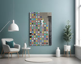 Dots glass wall art styled above a desk in a kids room