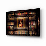 Bookshelf glass wall art displayed above a leather chesterfield in a mahogany-paneled library with brass desk lamp and antique books