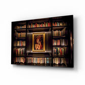 Bookshelf glass wall art displayed above a leather chesterfield in a mahogany-paneled library with brass desk lamp and antique books