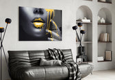 Yellow Lips glass wall art styled above a bed in a bedroom