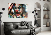 Jokers Laugh glass wall art styled above a sofa in a gaming room