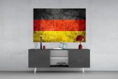 Flag of Germany panel catching low light to reveal its weathered gravity