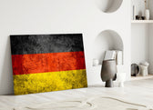 Flag of Germany close-up showing scratched metal texture across black red and gold bands
