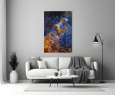 Space close-up showing rust-colored Pillars of Creation among indigo stars