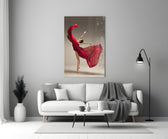 Ballerina close-up showing dancer en pointe with crimson silk swirling above arched back