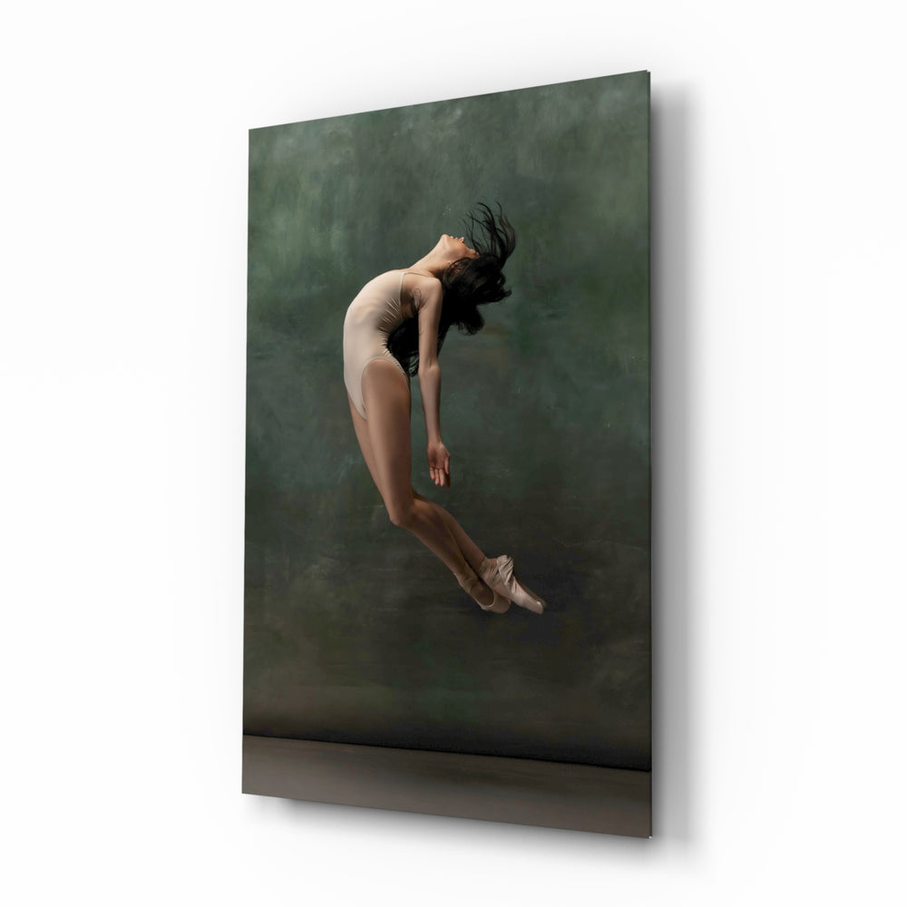 Ballerina glass wall art displayed above a linen bed in a moss-painted bedroom with rattan nightstands and brushed-brass sconces