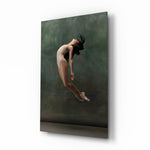 Ballerina glass wall art displayed above a linen bed in a moss-painted bedroom with rattan nightstands and brushed-brass sconces