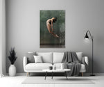 Ballerina close-up showing dancer mid-leap with hair fanned and head thrown back