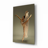Ballerina glass wall art displayed above a linen bed in a fawn-toned bedroom with rattan nightstands and brushed-brass sconces