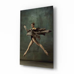 Ballerina glass wall art displayed beside a charcoal sofa in a moss-painted hallway with herringbone floor and brass picture light