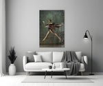 Ballerina close-up showing dancer mid-leap with billowing slate trench