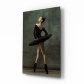 Ballerina glass wall art displayed above a charcoal velvet bed in a moss-painted bedroom with brushed-brass sconces and onyx nightstands