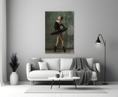 Ballerina close-up showing black-tutu dancer in profile en pointe