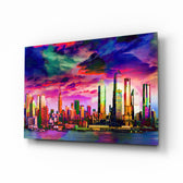 Colorful Silhouette of the City glass wall art displayed above a charcoal sofa in a violet-painted lounge with reclaimed-wood console and brass picture light