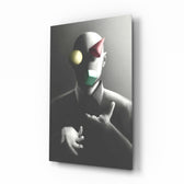 Juggler glass wall art displayed above a charcoal sofa in a slate-walled office lounge with steel desk and matte-black shelving