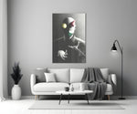 Juggler close-up showing bald figure with floating sphere cone and cube