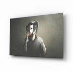 Masks glass wall art displayed above a charcoal sofa in a pewter-walled hallway with reclaimed-wood console and matte-black floor lamp