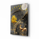 Golden Tree and Gazelles glass wall art displayed above a walnut sideboard in a slate-painted dining room with cane chairs and brass pendant lamp