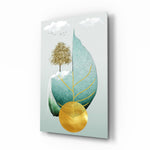 Tree on a Leaf glass wall art displayed above a marble vanity in a soft-mist bathroom with brushed-brass faucet and stoneware tray