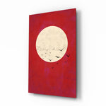 Fly from the Moon glass wall art displayed above a charcoal sofa in a crimson-painted lounge with reclaimed-wood console and matte-black floor lamp