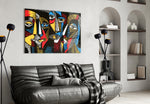 Faces glass wall art styled above a console in a hallway