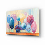 Trees of a Dream glass wall art displayed above a linen bed in a soft-blush kids room with rattan nightstands and brushed-brass sconces