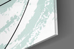 Chaotic artwork anchoring a wall with soft minimalist palette