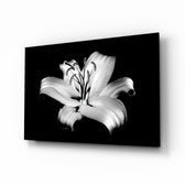 Lilies glass wall art displayed above a charcoal velvet bed in a slate bedroom with brushed-brass sconces and onyx nightstands