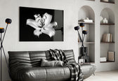 Lilies glass wall art styled above a bed in a bedroom