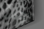 Leopard artwork anchoring a wall with dark primal palette
