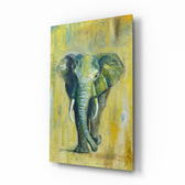 Elephant glass wall art displayed above a charcoal sofa in a marigold-painted lounge with reclaimed-wood console and brass picture light