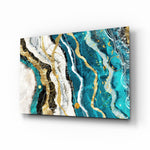 Marble Waves glass wall art displayed above a charcoal velvet bed in a slate bedroom with brushed-brass sconces and gold accent vases