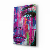 Woman Eye glass wall art displayed above a velvet bed in a magenta bedroom with rattan nightstands and brushed-brass sconces