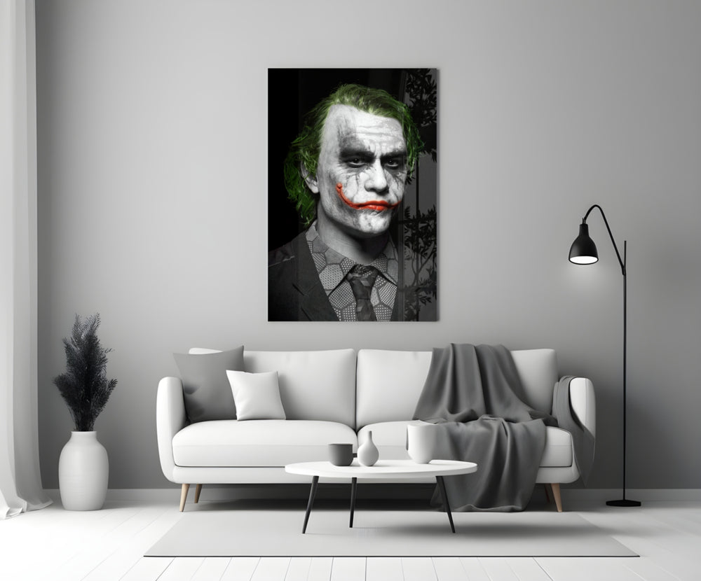 Joker close-up showing chalk face cracked grin and acid-green hair