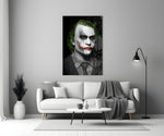 Joker close-up showing chalk face cracked grin and acid-green hair