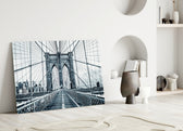 Brooklyn Bridge close-up showing pedestrian walkway and cable fan toward stone tower