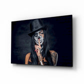 Sssh glass wall art displayed above a black leather sofa in a moody lounge with reclaimed-brick wall and brass arc lamp
