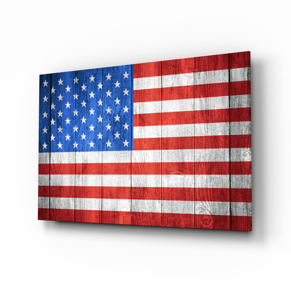 Flag of the United States glass wall art displayed above a leather chesterfield in a Americana lounge with reclaimed-wood console and brass picture light