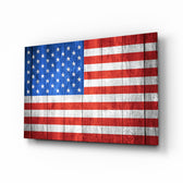 Flag of the United States glass wall art displayed above a leather chesterfield in a Americana lounge with reclaimed-wood console and brass picture light