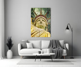 The Statue of Liberty close-up showing crown rays and torch hand against jade-and-gold sky