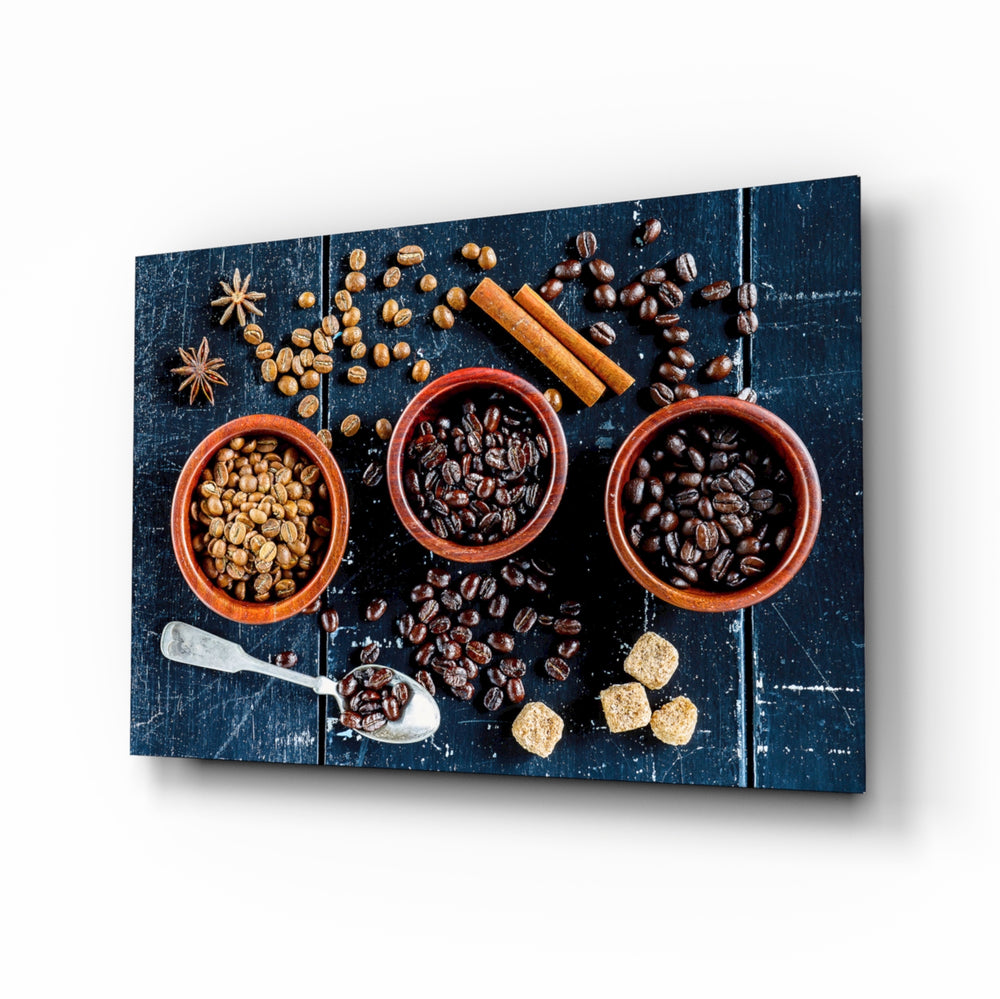 Spices glass wall art displayed above a walnut counter in a contemporary kitchen with rattan pendants and matte-black cabinets